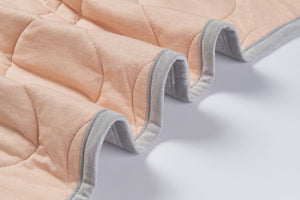 
            
                Load image into Gallery viewer, Small Bamboo Jersey Cozy Blanket 2.0 TOG - Pantone Bellini Drizzle
            
        